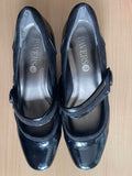 Stylish women’s Pavers shoes in black, with a glossy patent finish and a secure Mary Jane strap. 👠
