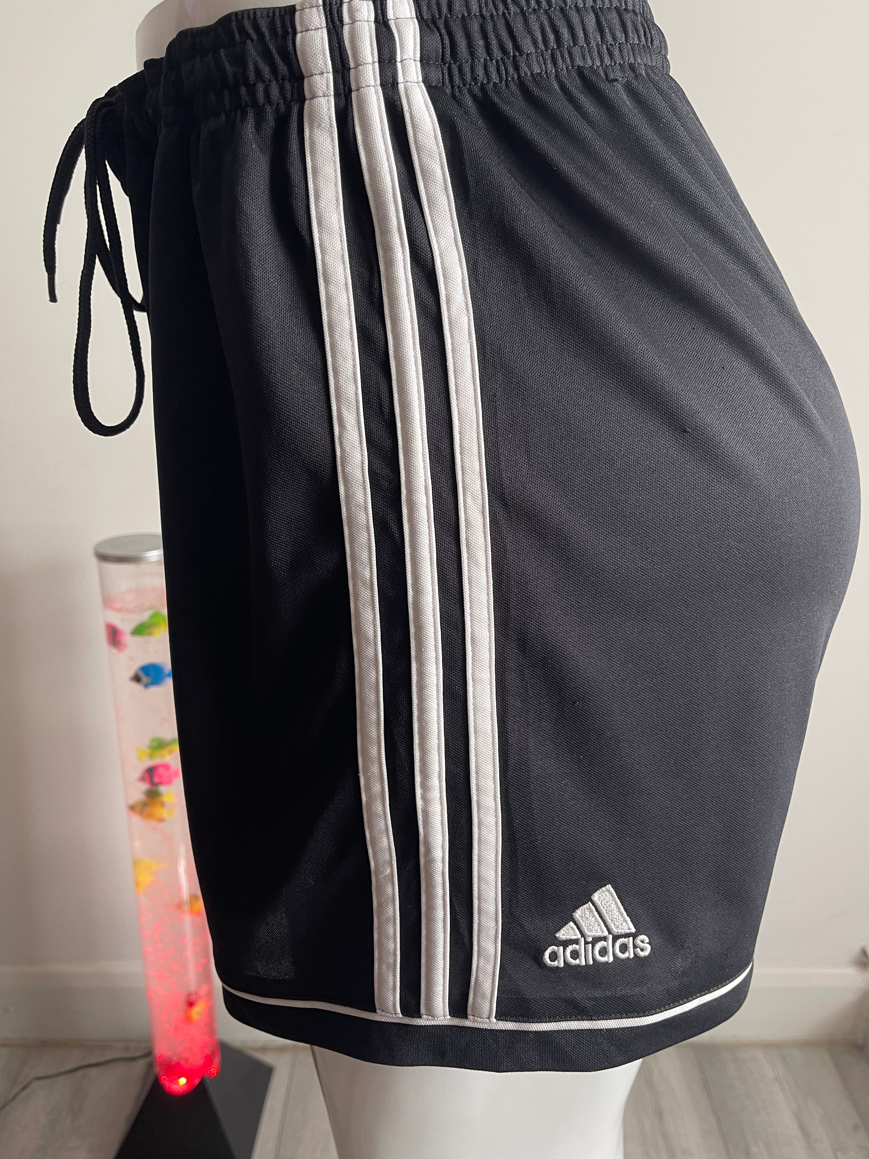 🏃‍♀️ Stylish Adidas women's training shorts in black with white side panel and Adidas logo.