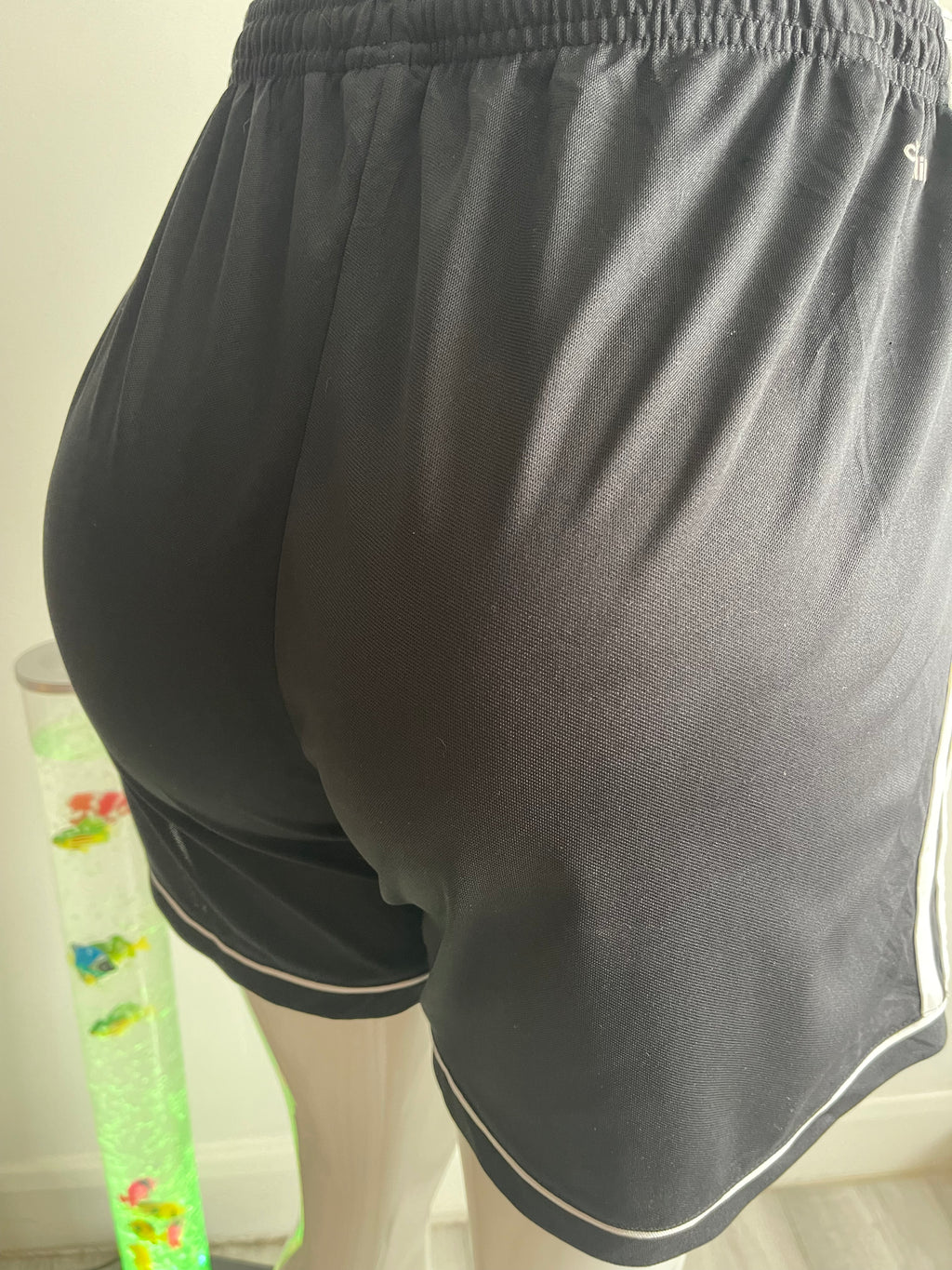 🏃‍♀️ Stylish Adidas women's training shorts in black with white side panel and Adidas logo.